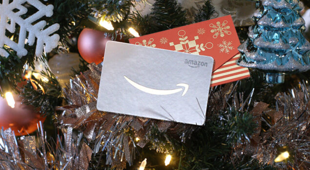 Amazon gift card sitting in a Christmas tree